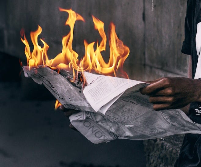 Newspaper on fire